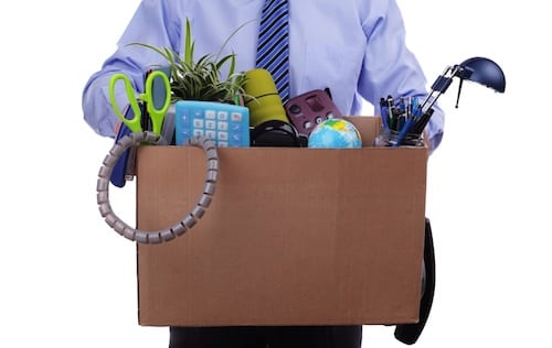 Unemployment concept, fired man with personal items in a box